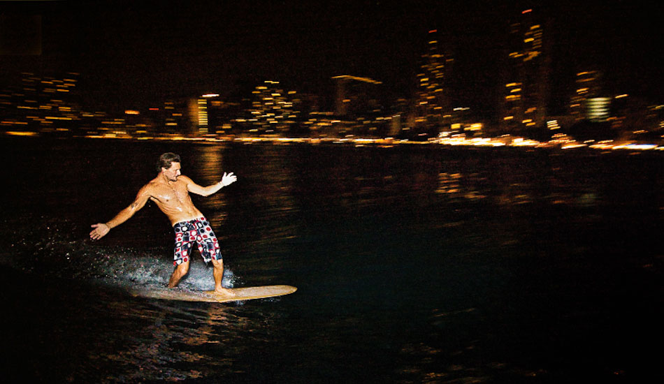 This was shot for Quiksilver. Shayne McIntyre night surfing Waikiki. On-camera flash with a 10-22mm lens. 1/15@F2.8 ISO 800 at 1/16 strobe power. The camera flooded seconds after this wave, and although the gear was lost the image was salvaged. Stoked. Photo: <a href=\"http://www.mikecoots.com\">Mike Coots</a>