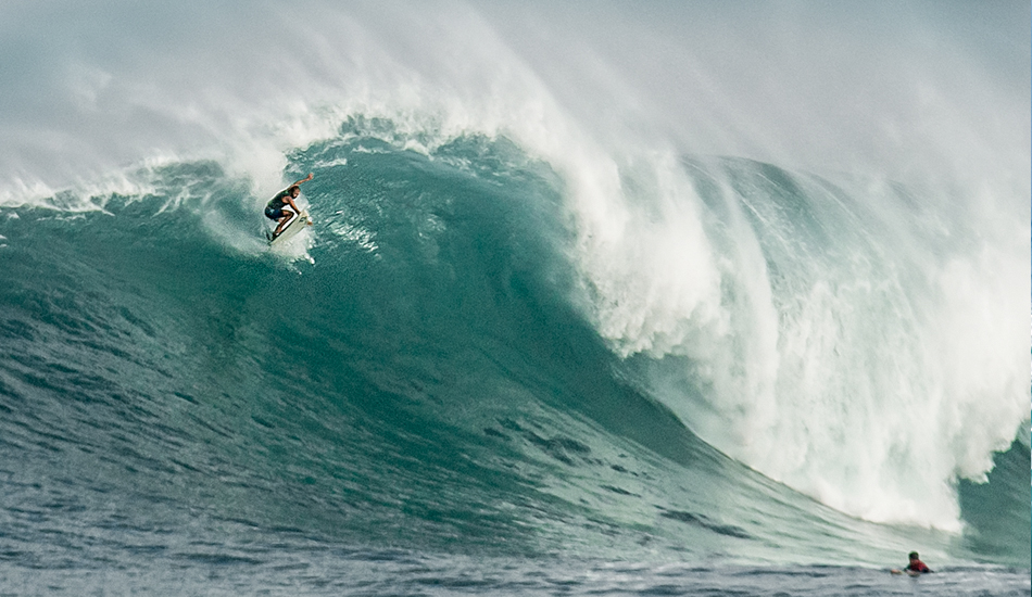 Wind up the face of a wave catches a board at Waimea.
 Photo: <a href=\"https://www.facebook.com/SCsurfshots\">Mike Healey</a>