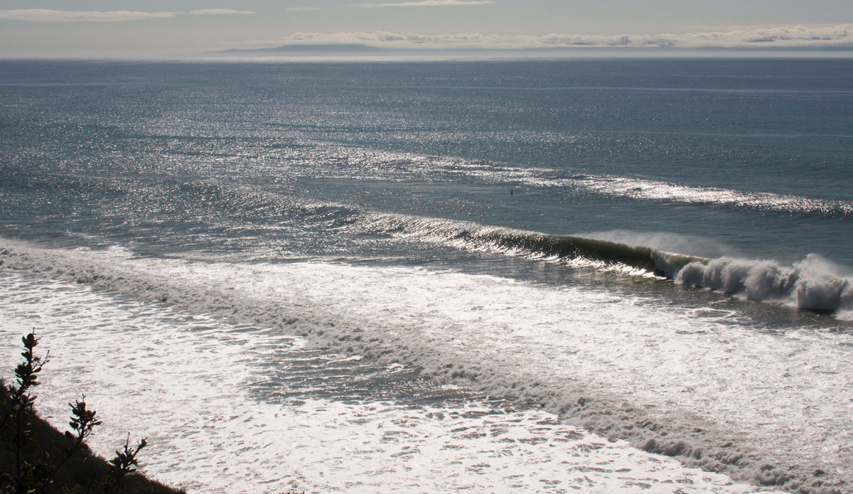  Offshore and steel blue, another pulse of West swell implodes unridden in Santa Babylon. Photo: <a href=\"https://www.milesjackler.com\"MilesJackler.com</a>