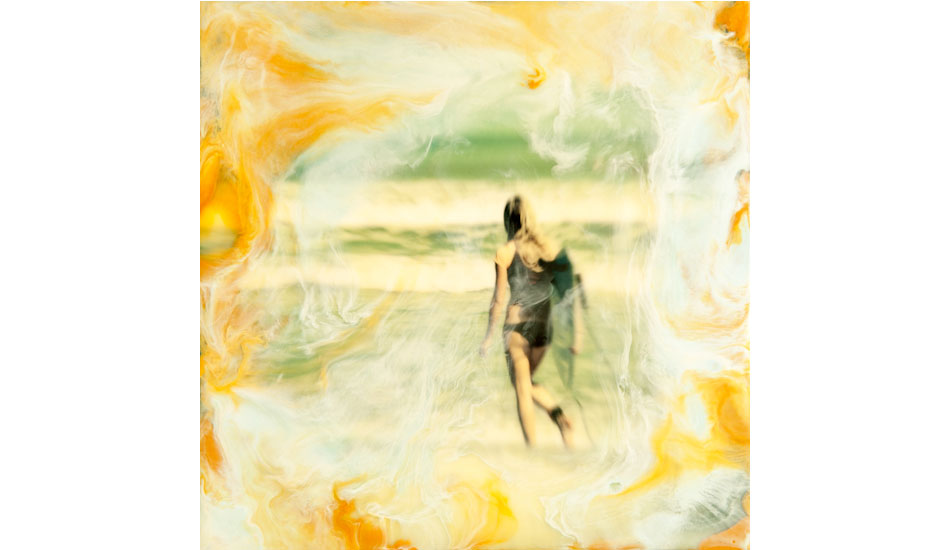 This is an image of a young lady entering the water. I mounted a print on a 8X8 inch wood cradled panel, and cover it in beeswax and damar resin, and then added pigmented wax using a heat gun to create the swirls of color to give it a dreamlike appearance. Photo: <a href=\"https://www.marksainwilson.com/?splash=1\" target=_blank>Mark Wilson</a>