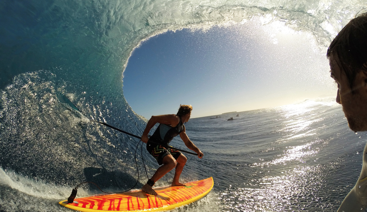 This GoPro POV shot of Laird Hamilton and me is one of my all time favs. I was using a Mygo mouth mount and Hero 3+ Black Edition. Shooting photos on time-lapse mode every .5 seconds. This was an early morning session before the Women\'s Fiji Pro. The event moved to Restaurants because of the size. It was about 6- to 8-foot backs and 12- to 15-foot faces. This wave, Laird was riding the wave for a while before I decided to take off behind him. It wasn’t planned, I just went for it. He didn’t know I was there until I pulled up into the barrel behind him. We both came flying out and he said, \"Let\'s go again!” meaning try to pull into the next section, but it looked long and fast so I straightened out. All morning I was shooting in video mode, but for this wave I decided to switch out to photo mode and I’m glad I did. In this photo you can see jet skis, boats, Tavarua Island, and, obviously, Laird on his 11-foot SUP. Photo: Anthony Walshs