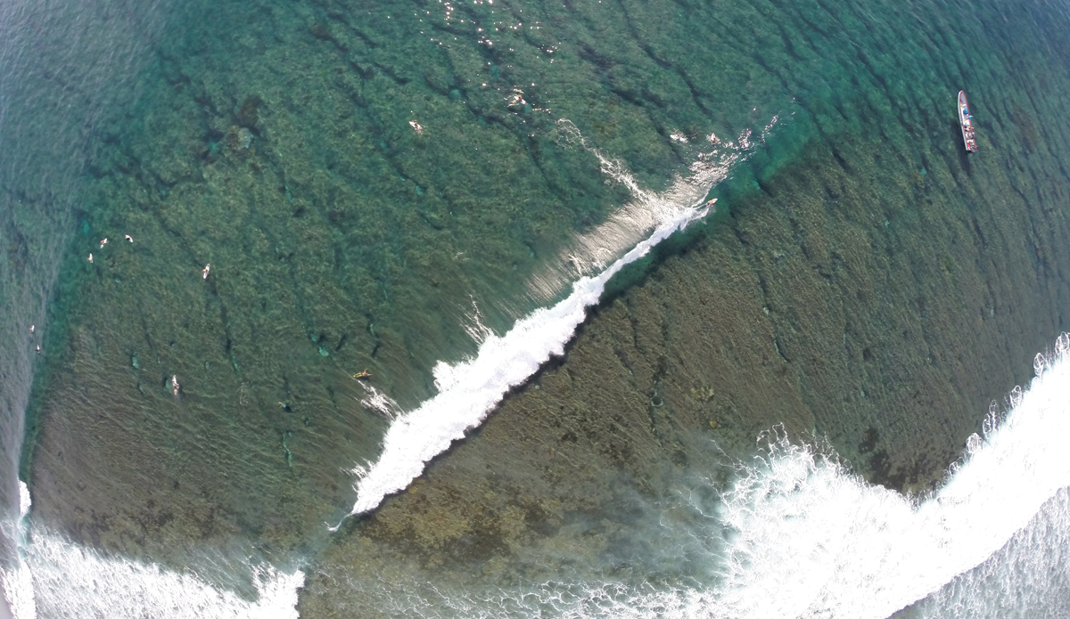 This shot is of Cloudbreak in Fiji. It was shot from a drone using a GoPro Hero 3+ Black Edition on time-lapse mode every .5 seconds. I flew it from a Tavarua resort boat from the channel, which you can see in this shot. Looking straight down on Cloudbreak when it\'s small is amazing, because you can see all the cracks in the reef and actually see all the different ledges that you surf. This day was about 3-foot backs and 6-foot faces, and it was the day before the waiting period started for the 2014 Women\'s Fiji Pro. Photo: Anthony Walsh