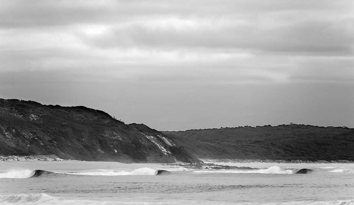 Another image from King Island. I shot this looking up the beach from where we were when we filmed and photographed Musica Surfica.    Although we had decent waves where we were, they looked a lot better about a mile up the beach. Just barrels rolling in completely empty of surfers, which can be pretty typical around this place. Photo: Sean Davey