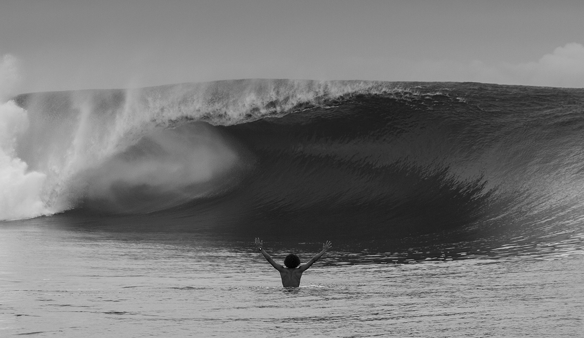 Eala Stewart in Tahiti. The morning of the huge swell of 2013 in Tahiti started off slow and was only about 4 feet at dawn. Eala Stewart and Landon McNamara paddled out mid-morning just as the swell started to jump a bit. This photo was taken just after Ealas first barrel of the trip. As he was paddling back out, I could see his huge smile as he just stopped and threw his arms up in the air. A moment of pure stoke from the humble Hawaiian. Two hours later, it was 15 feet and death defying.. Photo: <a href=\"https://davenelson-photography.com\">DaveNelson-photography.com</a>