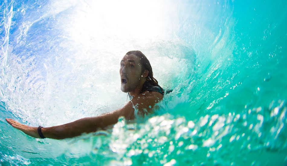 Downtime fun consisted of competitive games of pool, cards, slugging Bintangs, or in this case, body surfing. Brett Ayres with good form on the shore pound of Sumbawa. Photo: <a href=\"https://www.nickliotta.com\">Nick Liotta</a>