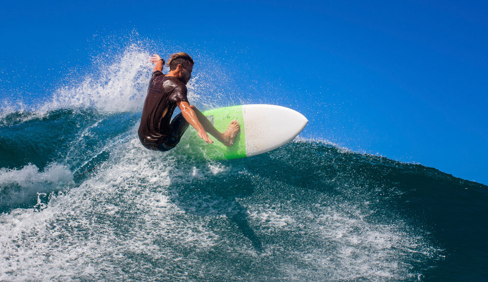 My brother, Greg, putting his new Luke Studer biscuit to use at a tropical left in Sumbawa. Photo: <a href=\"https://www.nickliotta.com\">Nick Liotta</a>