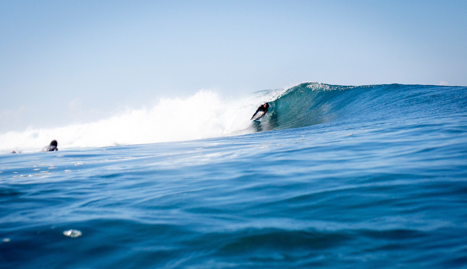 Damian, a french tour boat captain, stuffed tightly in a dreamy left barrel. Sumbawa, Indonesia. Photo: <a href=\"https://www.nickliotta.com\">Nick Liotta</a>