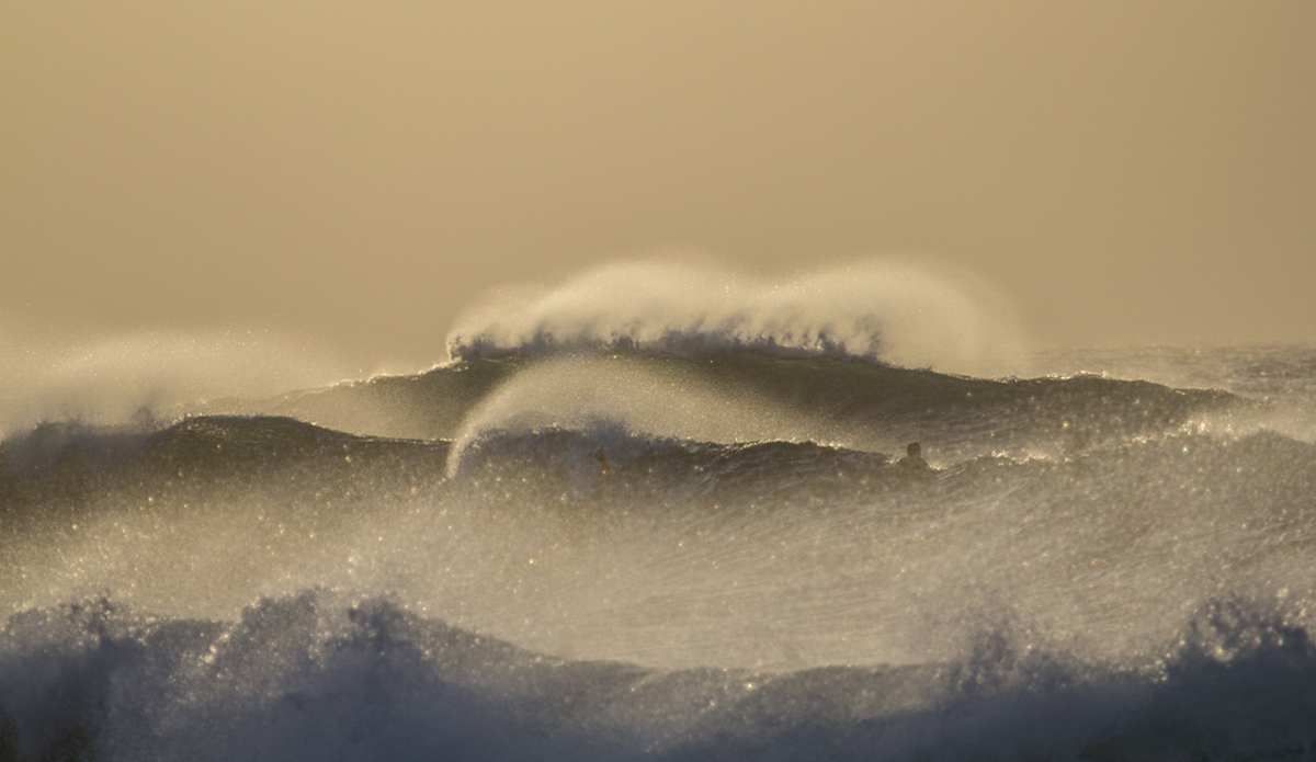 Maui Gold. I remember this was a hazy evening at Ho’okipa, as a new swell was coming in. The strong offshore winds made the spray look pretty cool. Photo: <a href=\"https://www.nickricca.com\">Nicks Ricca</a>
