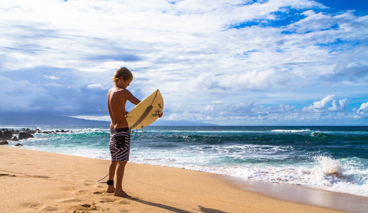 A moment of reflection before paddling out. Photo: <a href=\"https://www.nickricca.com\">Nicks Ricca</a>