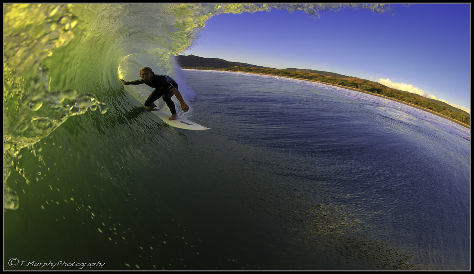 Afternoon at the \"rock.\" Lighting is great, the water is smooth as glass, and eight billion mosquito eyes stare at you, waiting for the sun to dip. Photo: Trevor Murphy