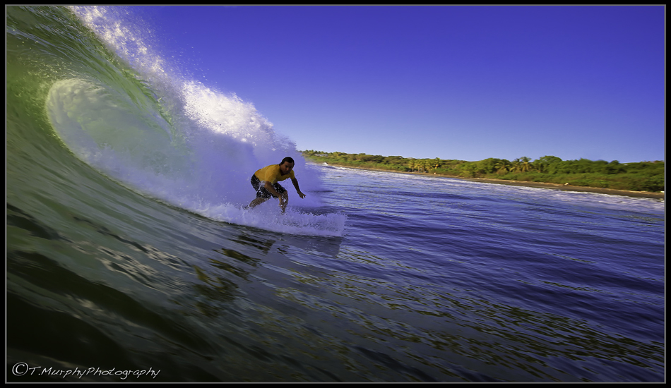 Local legend and one of the main influences that got me started in surf photography, Tony Roberts. He rips and his pics are epic.Tony\'s got the best of both worlds and a boat load of Pura Vida just in case you\'re running low. Photo: Trevor Murphy