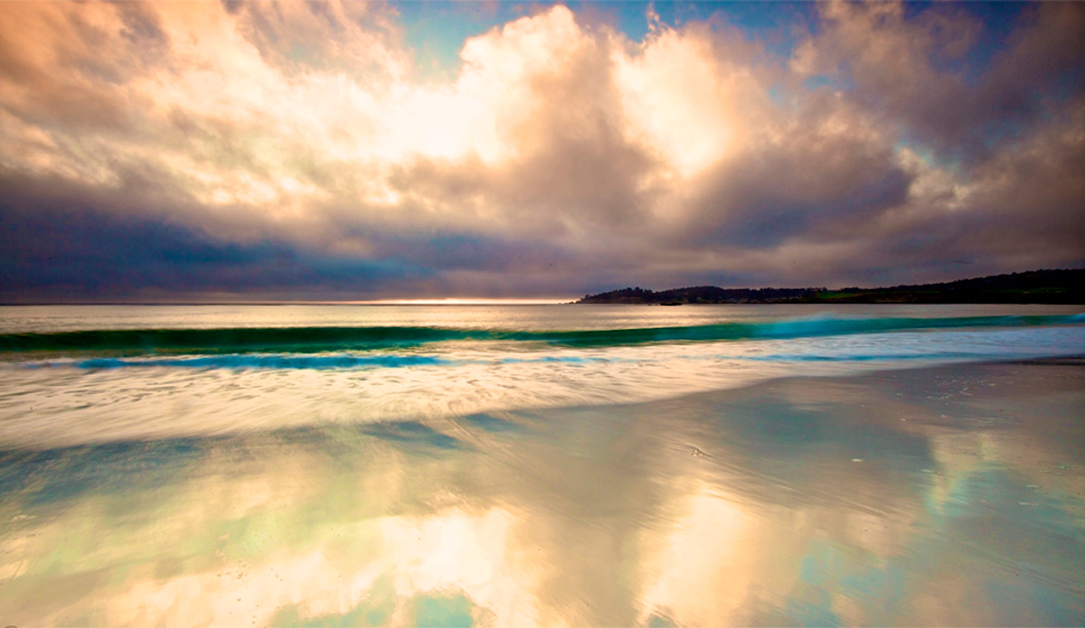 Carmel California, Sunset just passed and the sky was still bright enough to capture the reflections off the sand.  Image: <a href=\"https://gokenji.com/port/\" target=\"_blank\">Croman</a>