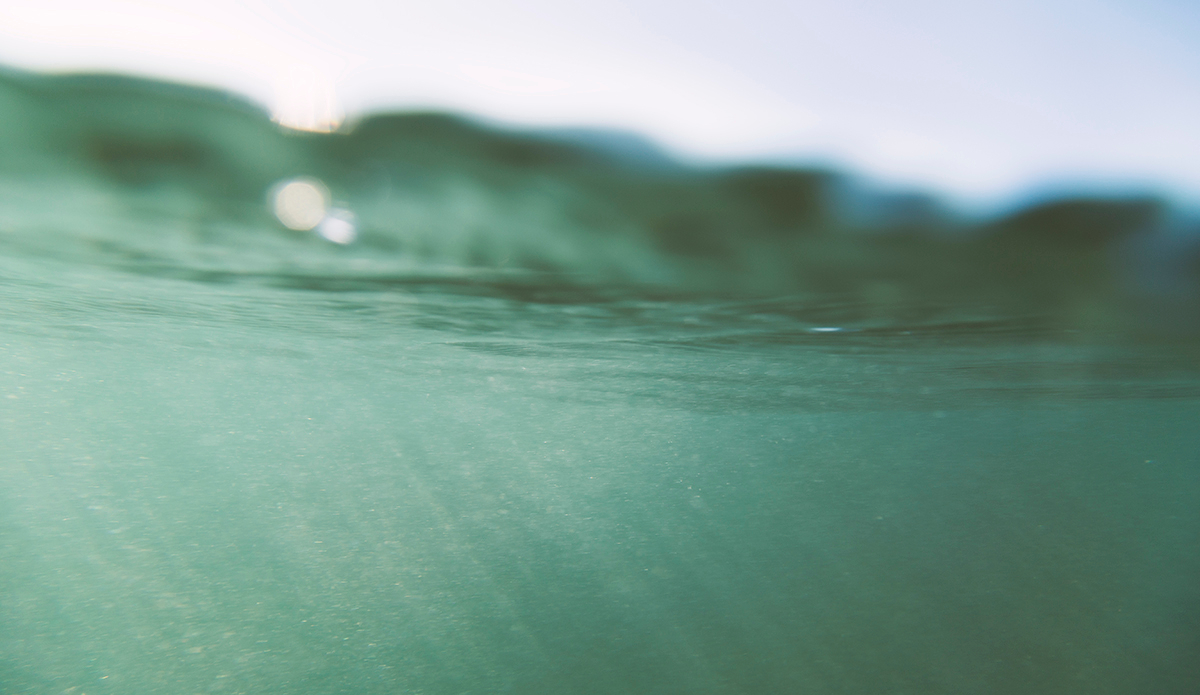 Catching rays of light in the vast body of water on a somewhat clear day. Black sand doesn’t allow much visibility  underwater. Photo: <a href=\"https://www.kheperphoto.com/\">Paola Núñez Linares</a>