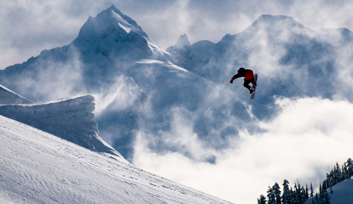 Logan short with a casual backside 180 in front of a really nice backdrop in Whistler. Photo: <a href=\"https://www.philtifo.com/\">Phil Tifo</a>