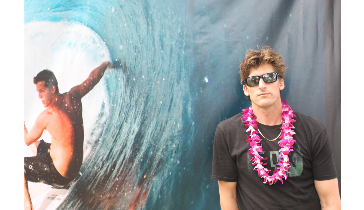 Bruce arrives at the contest and gets a quick pose in front of Andy’s poster. Photo: <a href=\"https://www.danegrady.com/\">Dane Grady</a>