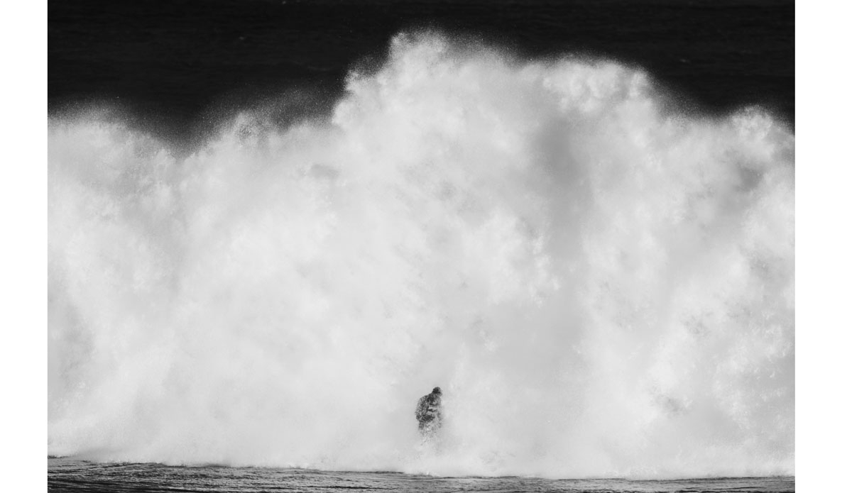 Unknown outrunning a white water explosion. Photo: <a href=\"https://mattdunbar.com.au/\"> Matt Dunbar</a>