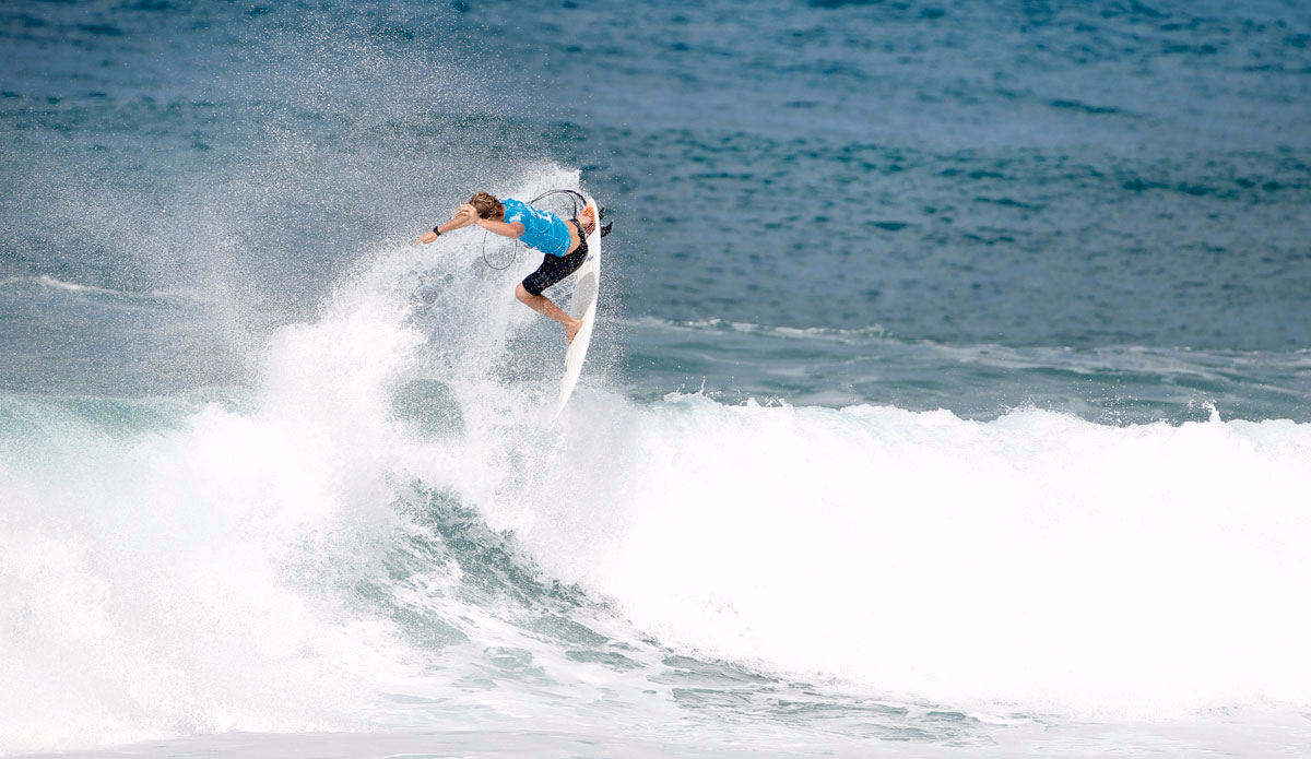 John John Florence of Hawaii (pictured) takes t the air to win his Round 1 heat at the Billabong Pipe Masters at Pipeline, Oahu, Hawaii on Thursday December 10, 2015. Photo: <a href=\"https://www.worldsurfleague.com/\">WSL</a>/<a href=\"https://www.instagram.com/kirstinscholtz/\">Scholtz</a>