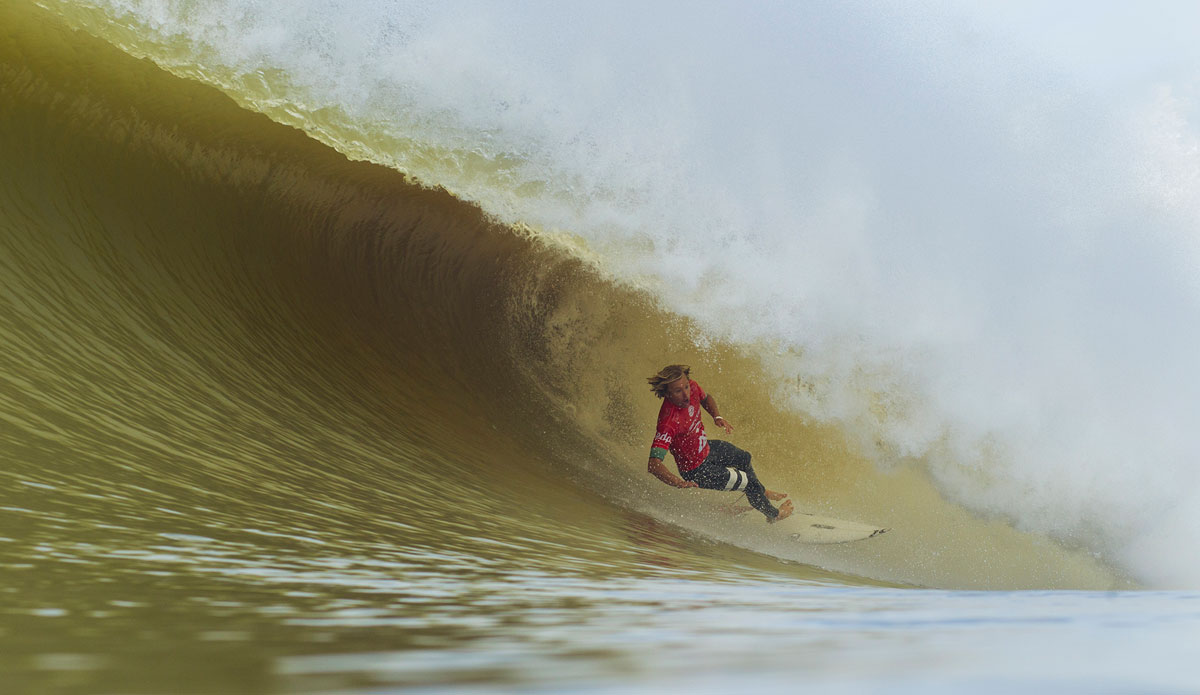 Adrian Buchan wipes out while surfing inside a barrel during Round 2 of the Moche Rip Curl Pro in Portugal. Buchan was eliminated from the event when he was defeated by advancing surfer Aritz Aranburu. Photo: <a href=\"https://www.aspworldtour.com/\">Damien Poullenot</a>