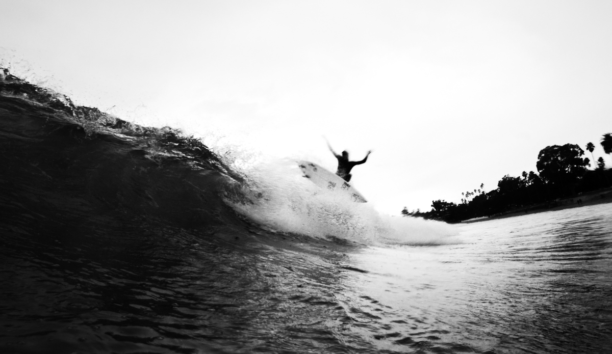 Los Angeles surfer Matt Hoffman showing his teeth on a gray day in Santa Barbara, California. Photo: <a href=\"https://www.maxxbuchanan.com/\">Maxx Buchanan</a>