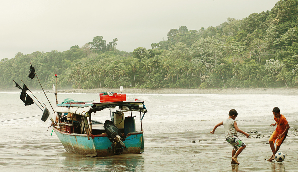 This is the beach were I taught my daughter to surf. Fishermen beached their boat at low tide, the kids got out and played soccer and the men walked into town and got gas, they were gone with the high tide.