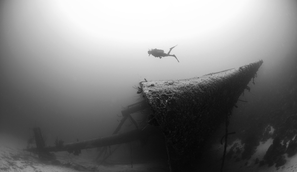 This is little sister Alese perusing a wreck in the Caribbean.  Fun fact: The (Helma Hooker) ship shown in image) ran drugs from Venezuela to the states. The boat broke on this island. Authorities found the loot, burned it and that is now why Aruba is called the happy island! Ship sank soon after in transit. Photo: <a href=\"https://www.rickyjlesser.com/\" target=_blank>Ricky Lesser.</a>