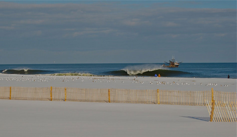 Double vision NJ. This makes me think of the Foreigner song \"Double Vision\" for some reason. This is a fun wave when it breaks and such cool scenery to play with when you\'re shooting. Can\'t beat that snow on the ground either. Photo: <a href=\"https://shcoleman4.wix.com/wwwstevecolemanphotocom\">Steve Coleman</a>