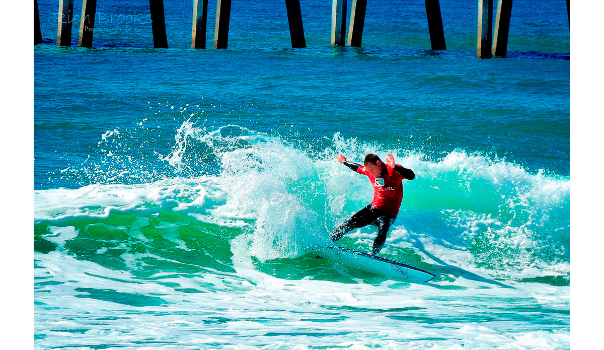 Justin Buxton throwing up some spray at the Mr. Surf\'s Cold Water Classic surf competition. And by cold water, they mean cold water relative to Panama City Beach. Photo: <a href=\"https://richbrooksphotography.squarespace.com/\">Rich Brooks</a>