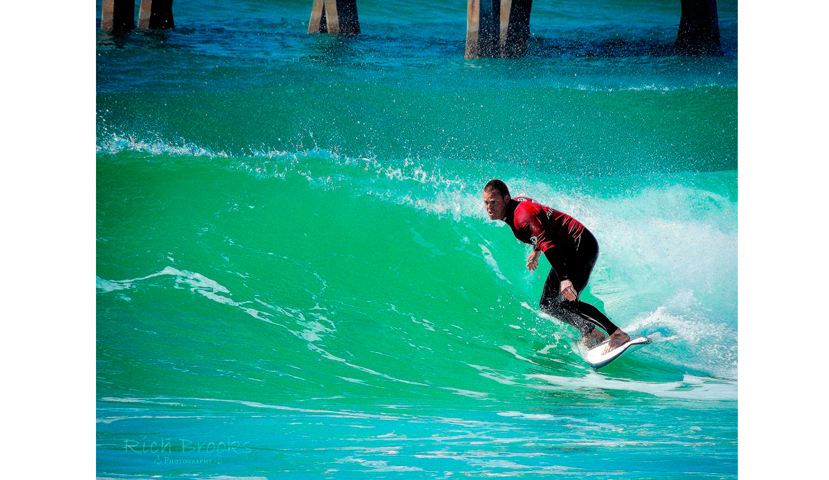 Justin Buxton working his line in Mr. Surf\'s Cold Water Classic surf competition. Photo: <a href=\"https://richbrooksphotography.squarespace.com/\">Rich Brooks</a>