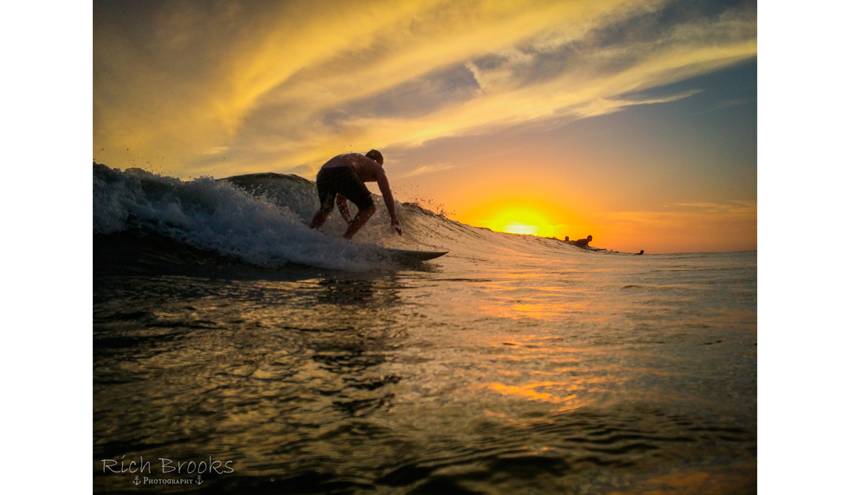 Take a left, and you can enjoy a stunning sunset as you cruise down the line. (Surfer: Alex Wood) Photo: <a href=\"https://richbrooksphotography.squarespace.com/\">Rich Brooks</a>