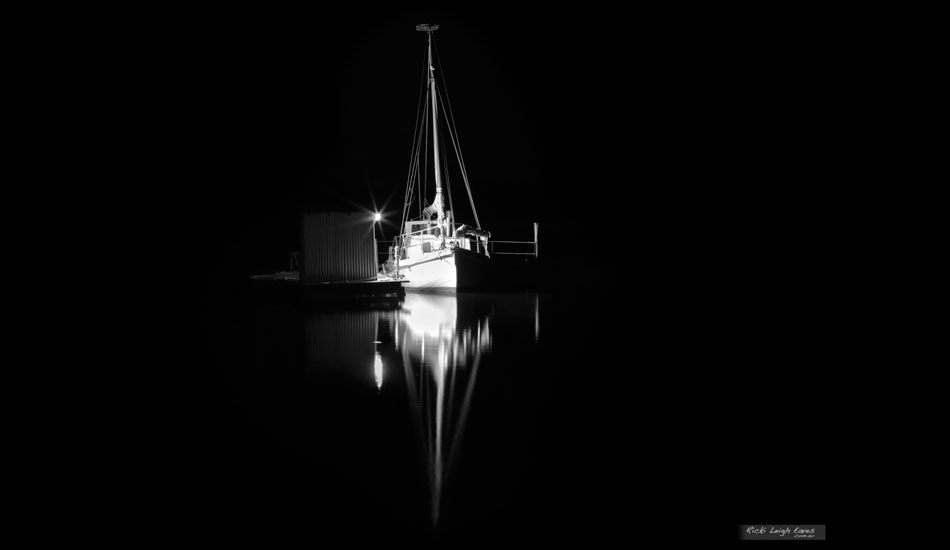 Just before this the beach was deserted and I out shooting the stars, then this fisherman showed up and lit up his boat from his cleaning shed, Boomer Bay, Tasmania. Photo:<a href=\"https://www.rickileigheaves.com.au\"> Ricki Eaves<a/>
