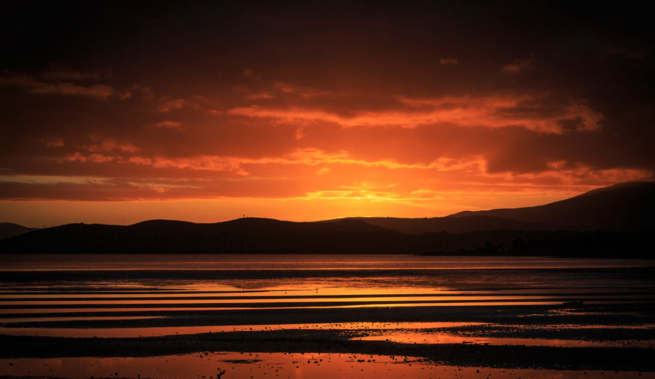 A vibrant sunset over the usually calm waters of Ralphs Bay, Lauderdale, Tasmania. Photo:<a href=\"https://www.rickileigheaves.com.au\"> Ricki Eaves<a/>