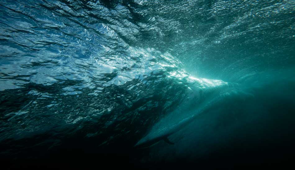 Joel Tudor from behind the curl. Photo: <a href=\"https://www.rickyjlesser.com/\" target=_blank>Ricky Lesser.</a>