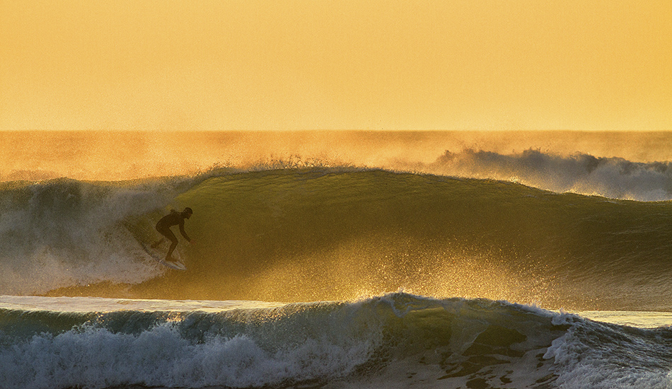 Shaper Felix Dickson test driving his own shapes in the Cornish evening gold. Photo: <a href=\"https://surfphoto.500px.com/home\"> Roger Sharp</a>