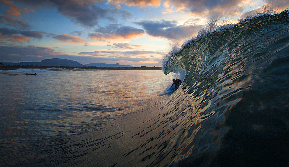 Ian Battrick getting the last tube home in Ireland. Photo: <a href=\"https://surfphoto.500px.com/home\"> Roger Sharp</a>