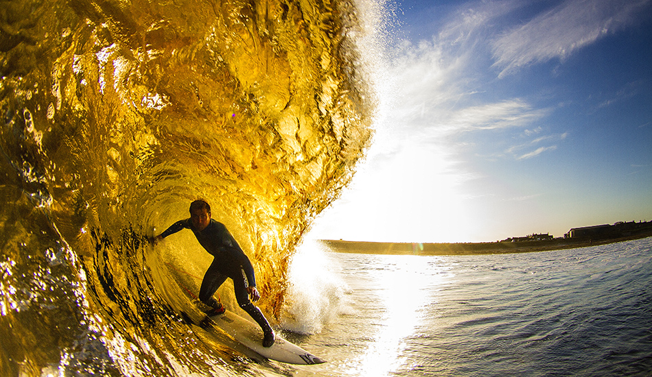 Peat particles in the water make for beer coloured barrels for Micah Lester at Thurso. Photo: <a href=\"https://surfphoto.500px.com/home\"> Roger Sharp</a>