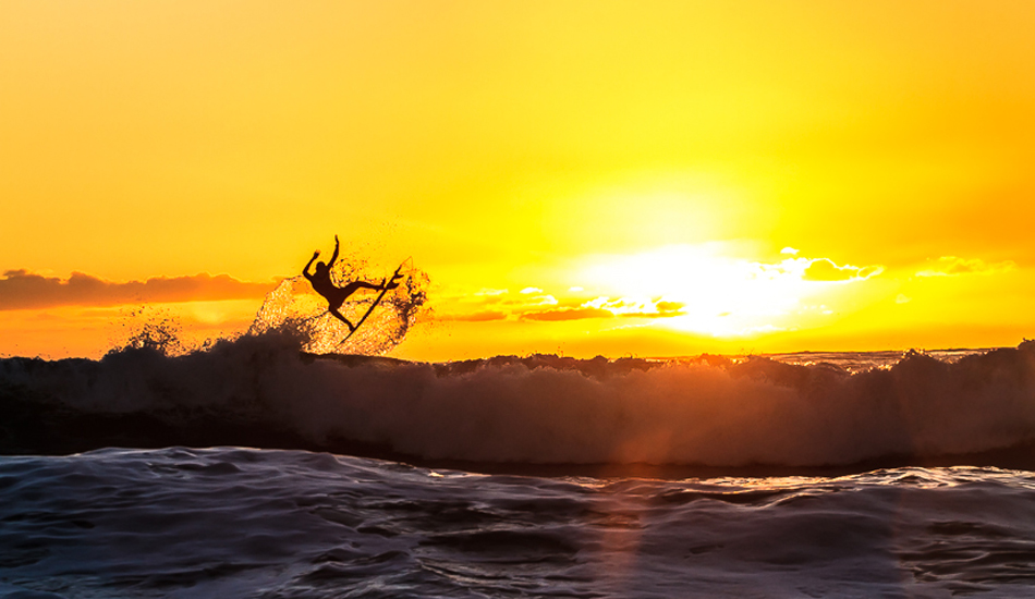 Tristan Sullaway taking flight at sunset. Photo: <a href=\"https://www.surfingeye.com/\" target=_blank>Ronald Hons</a>.
