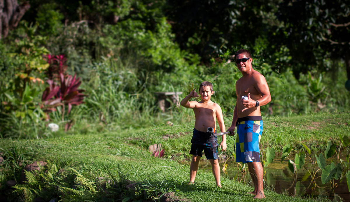 My good friend Manu Akana and his son Makoa. Born and raised on the beach at Honolua Bay, I give Manu the unofficial tag of Mayor of Kapalua.  If you surf Honolua there is a good chance you will see this legend. Organic farmer by trade, Manu is also passionate about keeping Honolua safe from development, pollution, and anything that would changed the surroundings of the Bay. <a href=\"https://www.rookemedia.com\">Tyler Rooke</a>