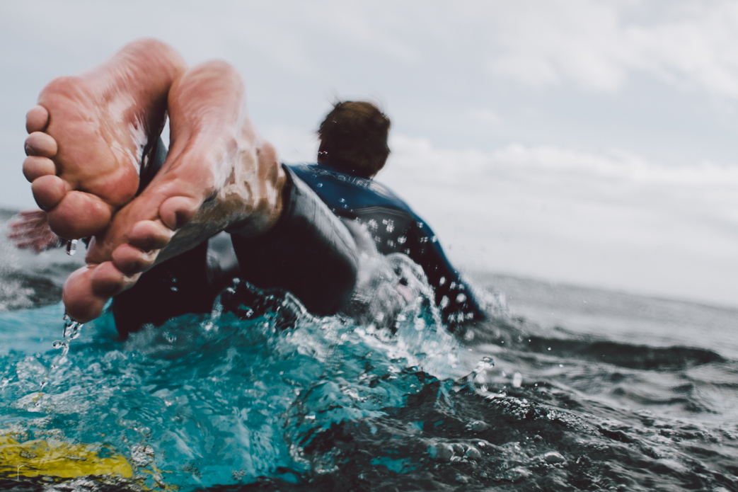Twin brother, Neil Holliday, paddling out for another. Photo: <a href=\"www.russellholliday.com\">Russell Holliday</a>