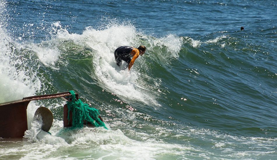 Clay Pollioni surfing the shipwreck. Photo:<a href=\"https://ryanmackphoto.blogspot.com/\" target=_blank>Ryan Mack</a>.