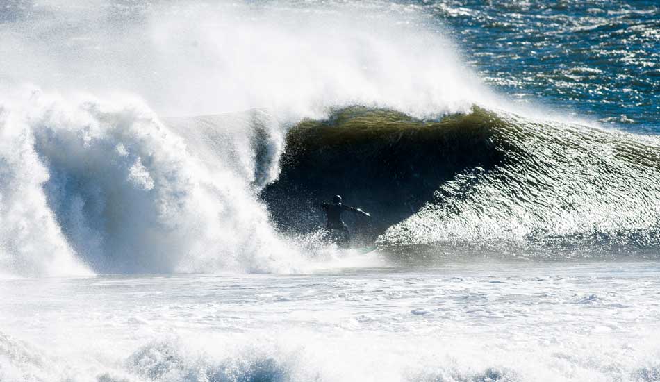 Andrew Gleser, surfing the morning we received a foot of snow and -4 windchill. Photo: <a href=\"https://instagram.com/ryanmackphoto\">Ryan Mack</a>