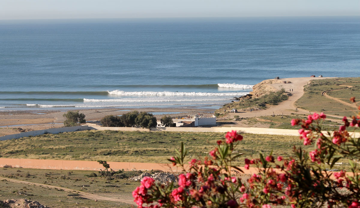 An empty set peels perfectly by two surfers. Not the worst view I’ve had from my bedroom. Photo: <a href=\"https://www.ryanwattersphoto.com/\">Ryan Watters</a>