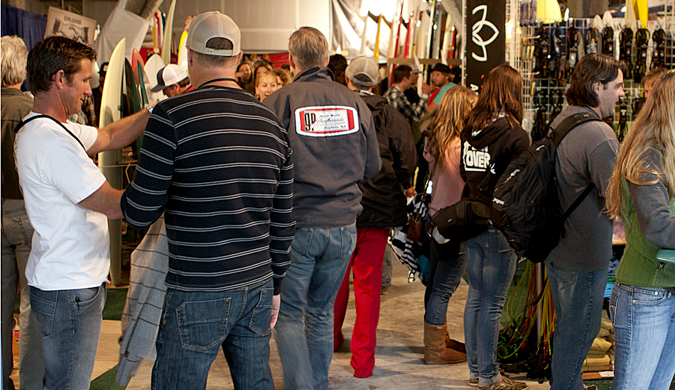 Regular surfers and surfing icons alike flocked to Sacred Craft to
check out the boards, the equipment, new technology and live shaping.
Robert \"Wingnut\" Weaver (white t-shirt, far left) of Endless Summer II
fame was among the 3,200 in attendance. Photo: Maggie Yount