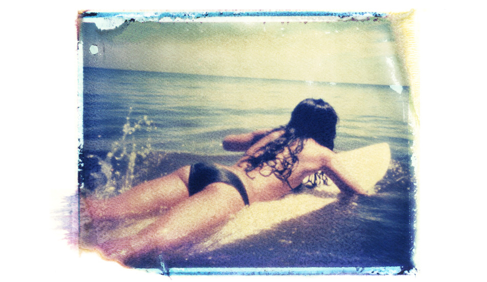 Surfer girl. A beautiful girl, a perfect splash, and perfect edge on the Polaroid. Image: <a href=\"https://shehitpausestudios.com/\" target=\"_blank\">Schwartz</a>