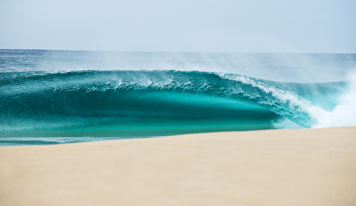 A rare north swell from a cyclone earlier in 2018, I’d just had shoulder surgery after a mountain bike stack. I couldn’t swim water and could barely lift my camera but I wasn’t going to miss it. This was a sneaky one down the line that I don’t think anyone shot. Love the emerald glow in this one. 
Photo: Scott Bauer // @scottbauerphoto