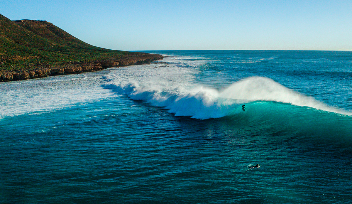 Lockie Caldwell (@doowekans) in the West Oz desert. Camping in the desert isn’t everyone’s thing and you have to pay your dues. It’s windy, dry, dusty, there are heaps of flies, sea urchins, and when it finally rains it usually pours. But when you score it’s magic. 
Photo: Scott Bauer // @scottbauerphoto
