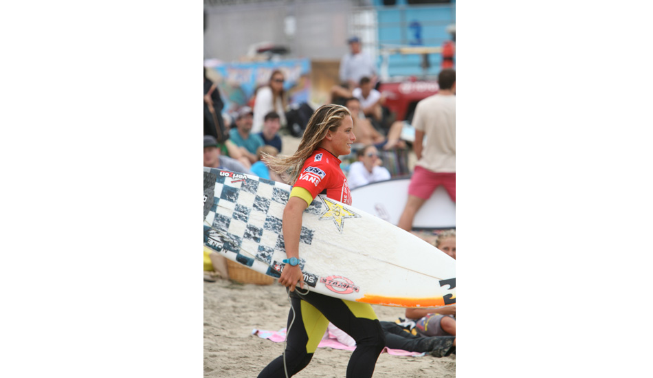 The picture of stoke: running out to her heat, board in hand, smile across her face. Photo: Scott Durzo