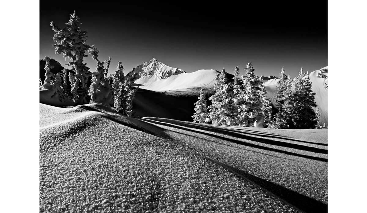 I stopped for a break on the way to work one day to snap this photo. Not a lot of people can say they ride a snowmobile to work. British Columbia. Photo: <a href=\"https://scottserfas.com/\">Scott Serfas</a>