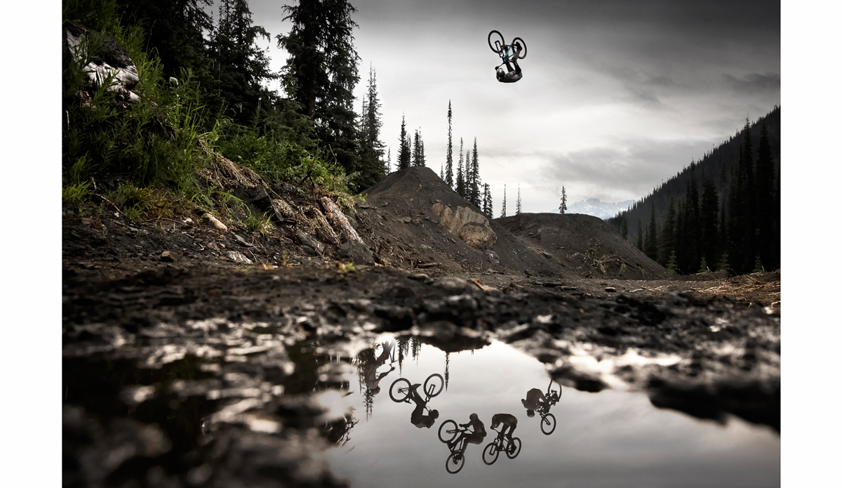 I laid in the dirt ready to shoot this photo for 20 minutes while Thomas Genon rolled up and down the lip of this jump, trying to wrap his head around trying this front flip. British Columbia. Photo: <a href=\"https://scottserfas.com/\">Scott Serfas</a>