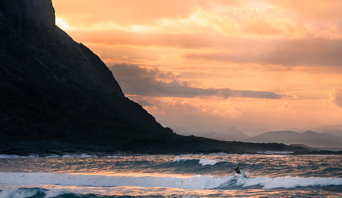 Scattered clouds and a spectrum of pastel colors. Sea eagles nest on the mountain side. Islands are no longer hiding in the horizon. Waves begin where sea or sky don’t matter. Photo: Photo: <a href=\"https://www.fjordlapsephotography.com/\">Fjordlapse Photography</a>