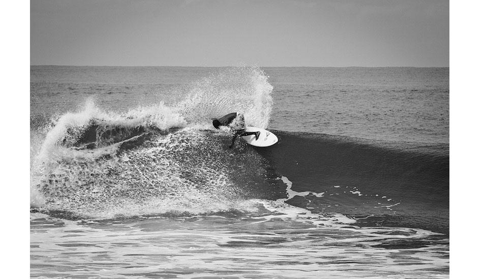 Alfred Lomax, Liberia\'s first surfer, lays down a backside hack. Photo: Sean Brody